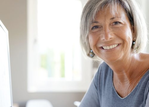 Smiling woman with facial wrinkles