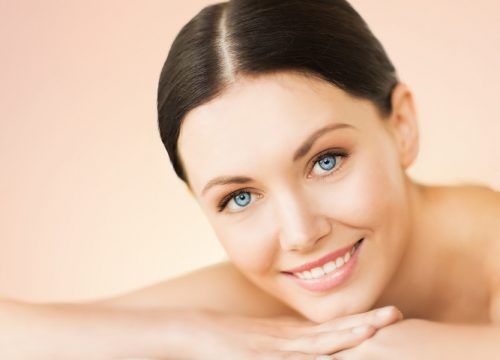 picture of woman in spa salon lying on the massage desk