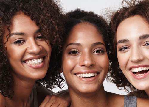 Three happy female friends after narrow band UV light therapy